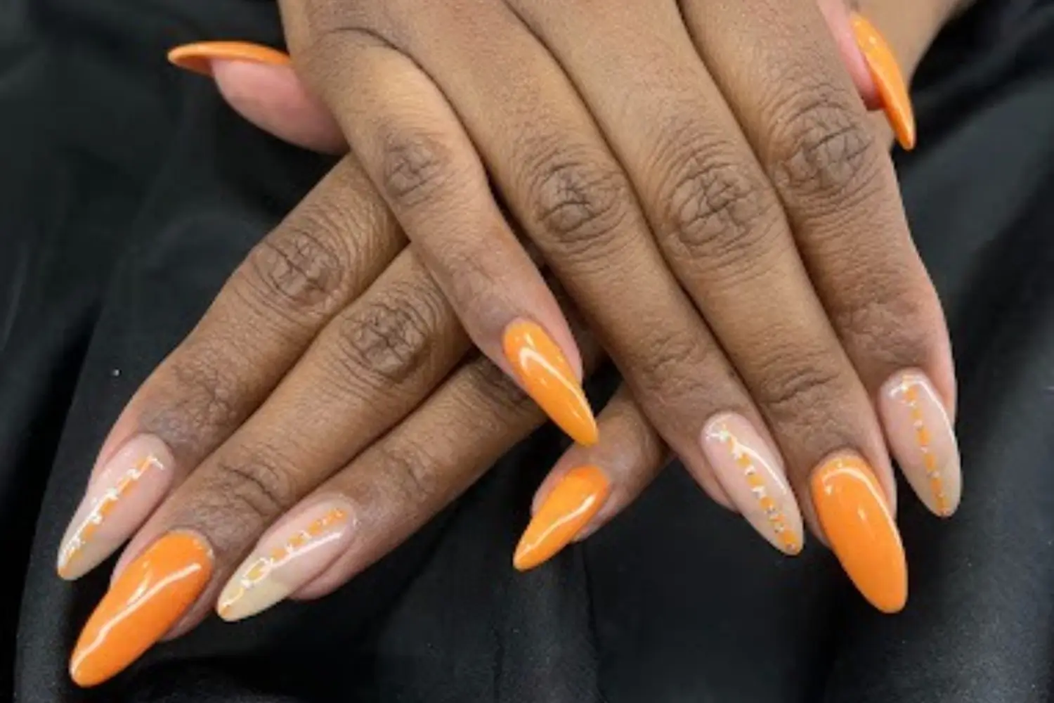 Close-up of a manicured hand with elegant UA Gel Powder nails in Mississauga.